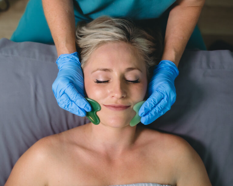 Gua sha stone facial massage
